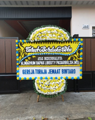 Papan Bunga Duka di Sukajaya